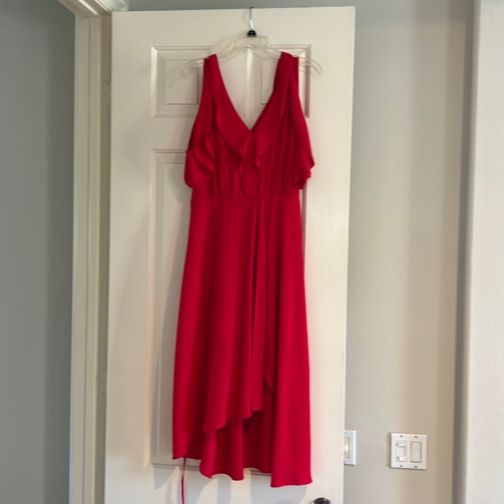 Flowy dress, with a front opening . It is low high. Worn 2x not washed